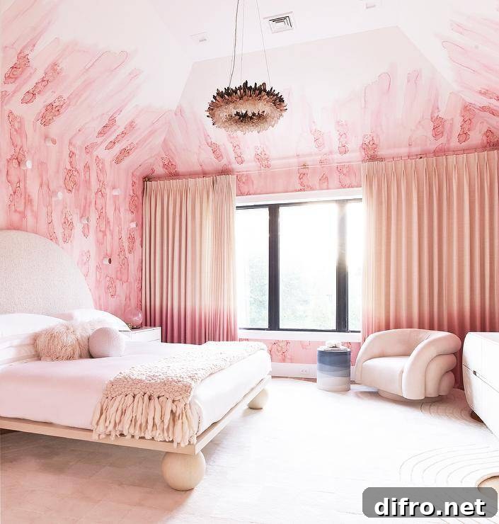 Pink and cream contemporary bedroom with velvet accent chair and soft rug.