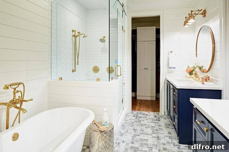 This master is very elegant with it’s navy vanities, marble tile and of course brushed gold fixtures.