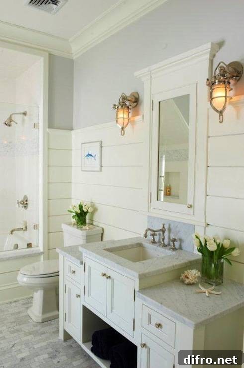 Cottage bathroom with gray paint color paired with white tongue and groove walls and white bathroom crown molding.