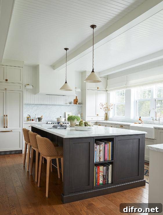 Stacked cookbook shelves are fitted to a black kitchen island topped with a marble countertop and matched with brown woven stools lit by white and black vintage lanterns.