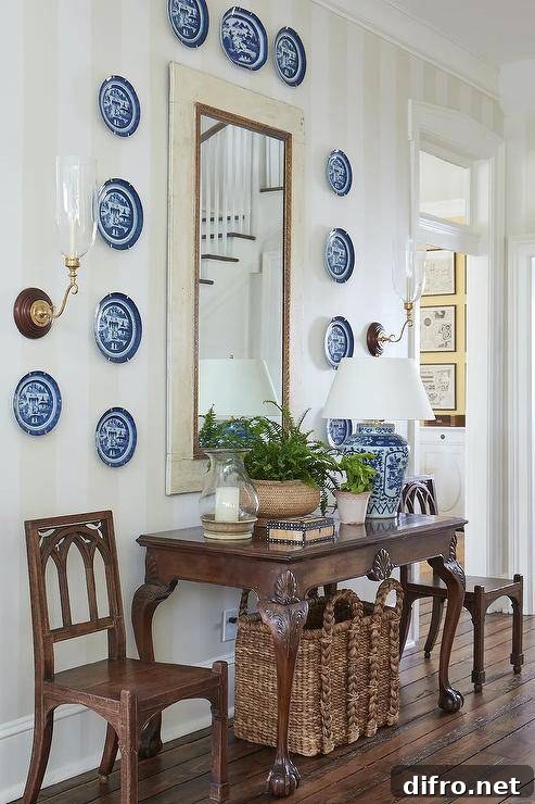 Vintage foyer table with decorative plates and mirror
