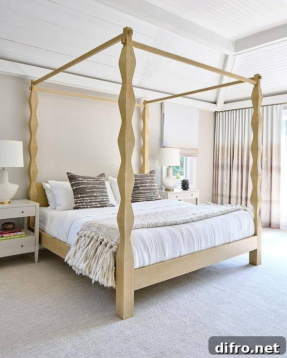 Gold carved wood canopy bed with brown woven pillows flanked by white nightstands.