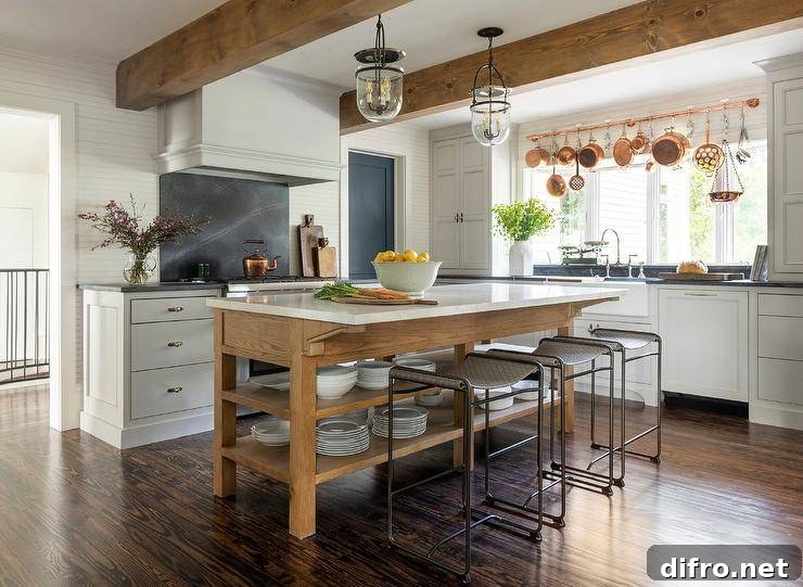 Seeded glass bell jar lanterns light an oak island boasting stacked shelves.