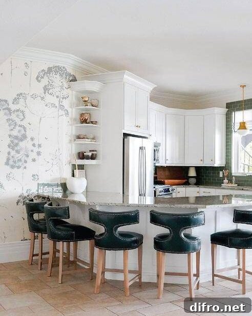 Teal t-back leather stools at a curved granite peninsula