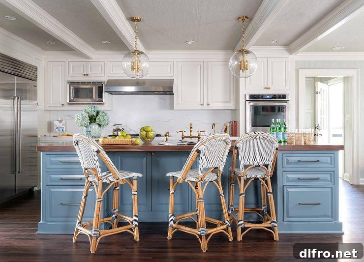 White and blue kitchen with rattan counter stools