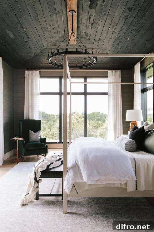 Black oak plank vaulted ceiling above a bedroom with a light gray wooden canopy bed and a black round chandelier.