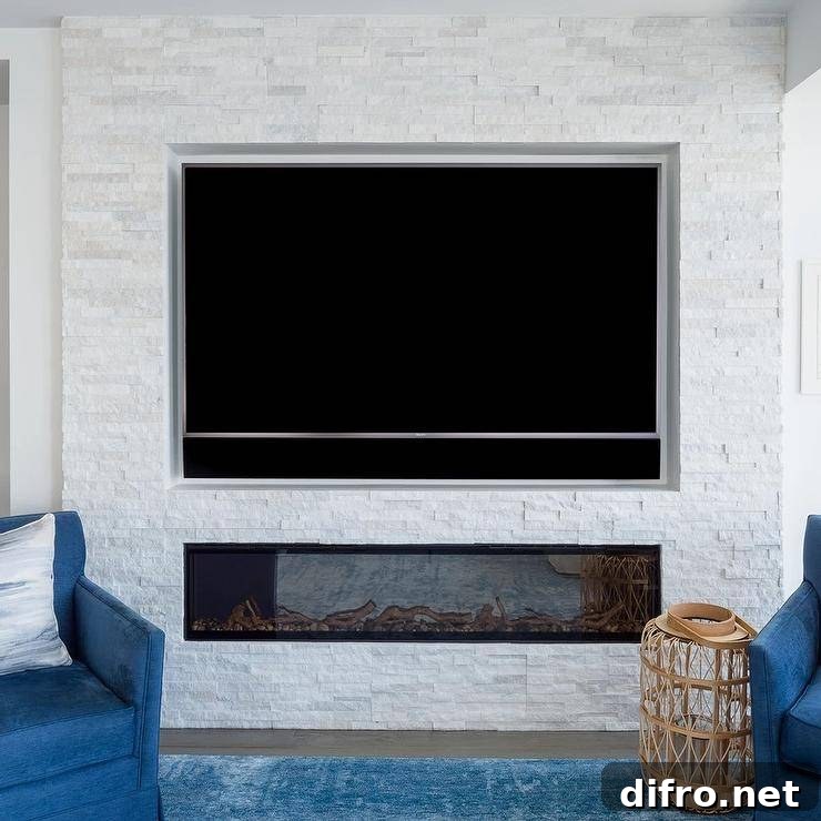 A TV sits over a modern gas fireplace with white stacked stone tiles.