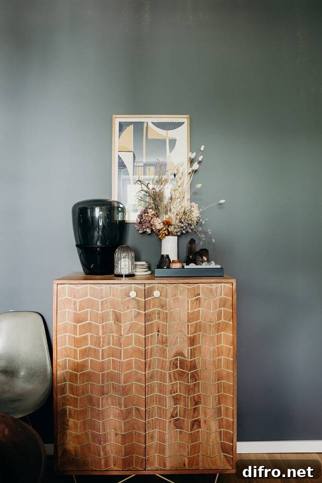 Retro dresser with geometric pattern against a charcoal wall