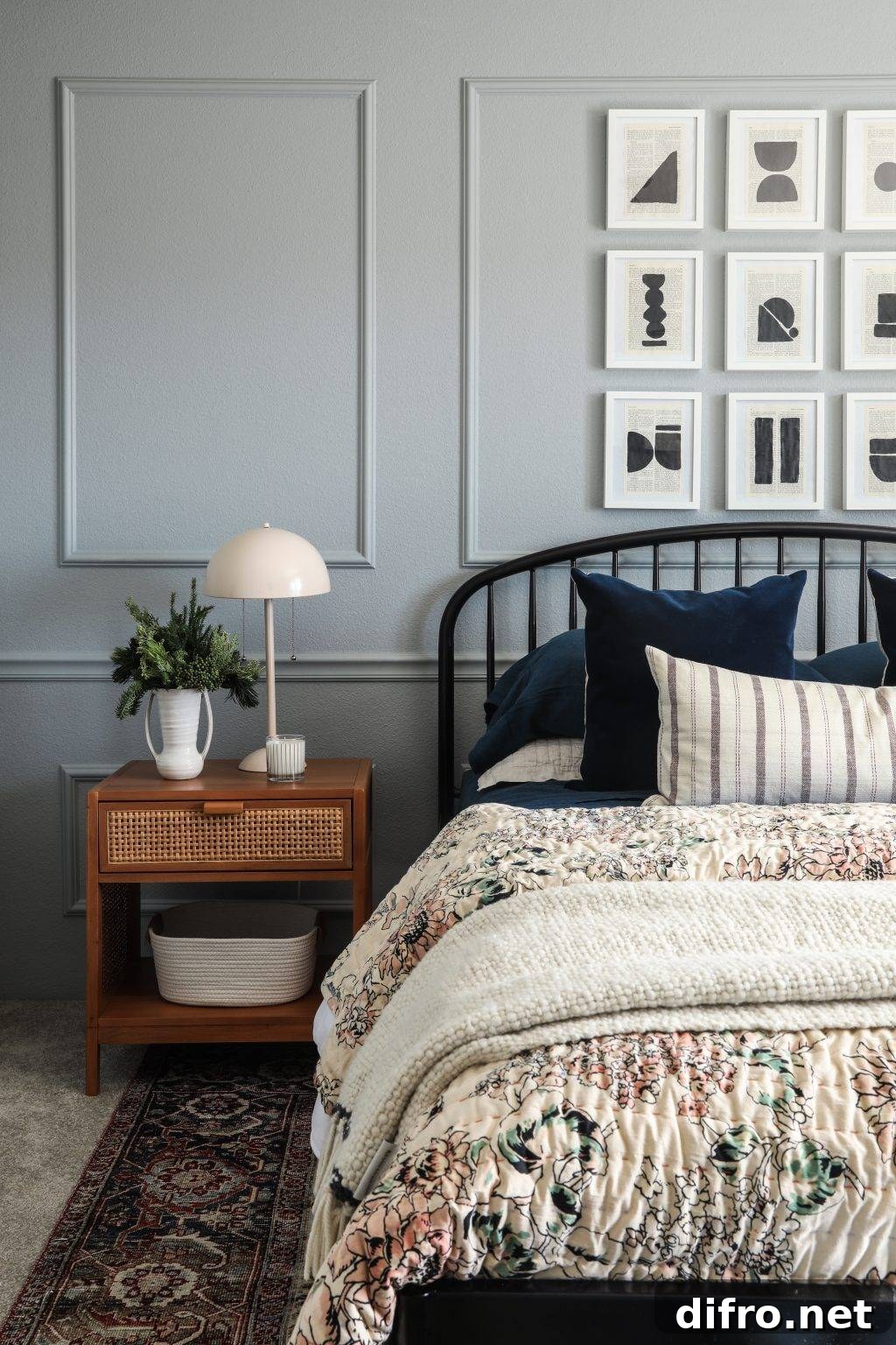 Bedroom with floral bedding and Moroccan rug sharing similar colors