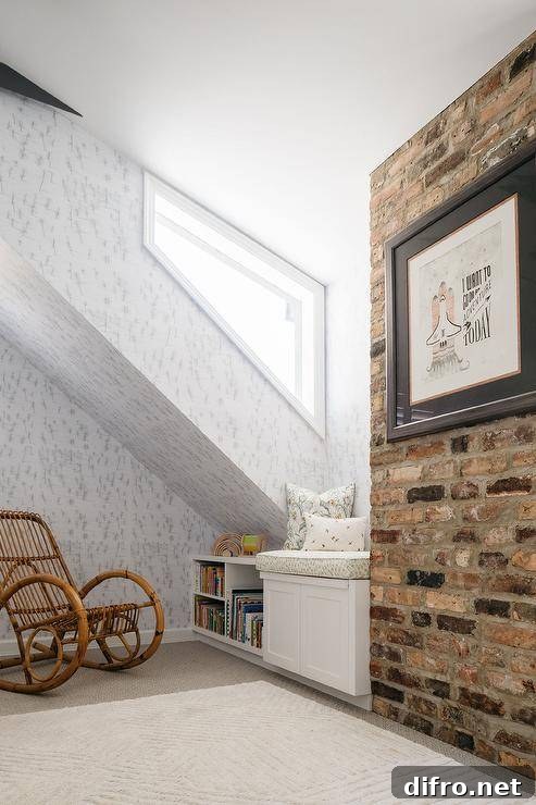 Attic nursery with exposed brick wall and rattan rocker.