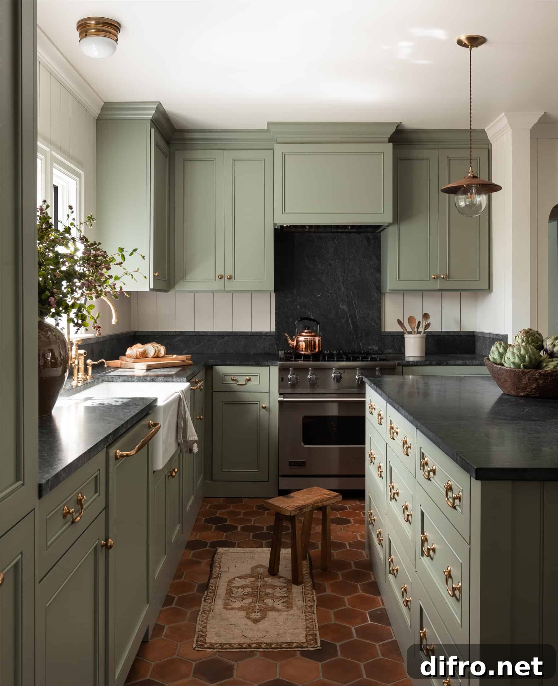 green kitchen cupboards with black onyx countertops