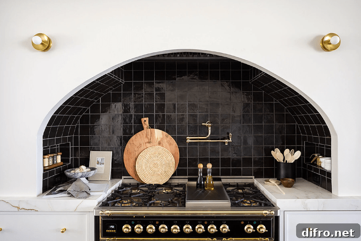 Brass swing arm pot filler over a stove with black tile backsplash