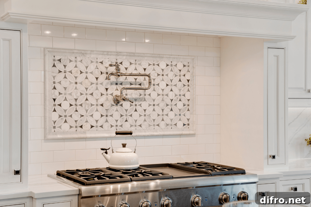 Polished brass pot filler over marble backsplash