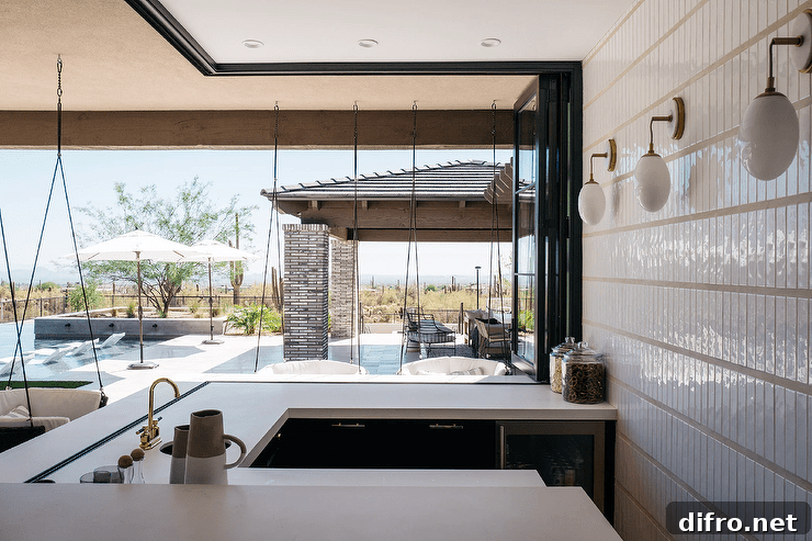 U-shaped black and white patio outdoor bar design features hanging chairs.