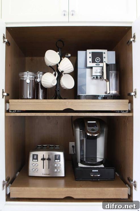 Coffee cabinet is fitted with pull out shelves.