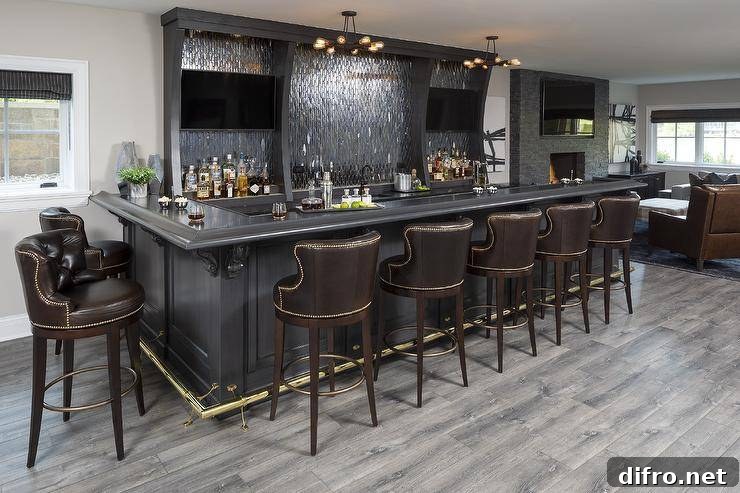 Handsome black wet bar with leather swivel barstools and black diamond backsplash tiles.