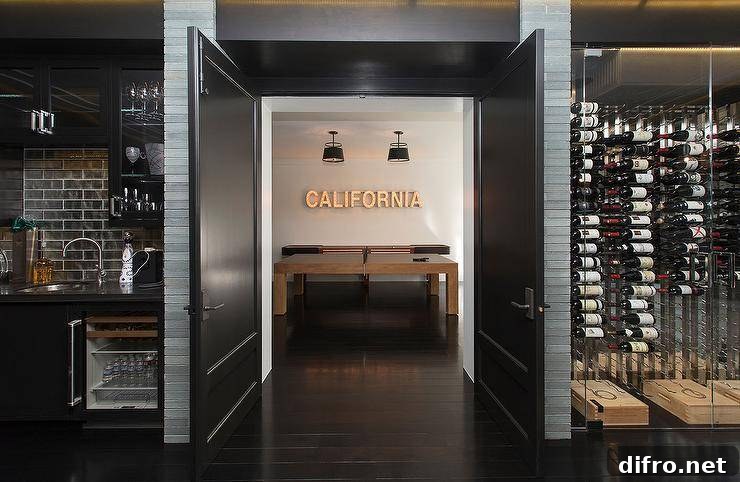 Contemporary black wet bar with glass-front fridge, polished nickel sink, and wine cellar nearby.