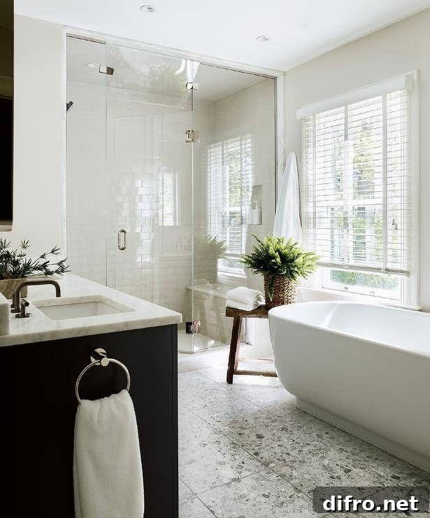window covered in white blinds above a bathtub