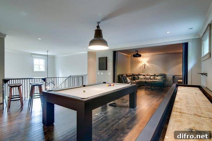 Game room with pool table, shuffleboard and leather sectional