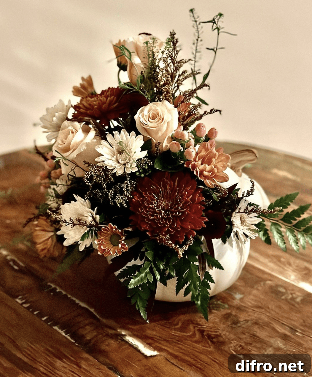Fall flowers in white pumpkin.