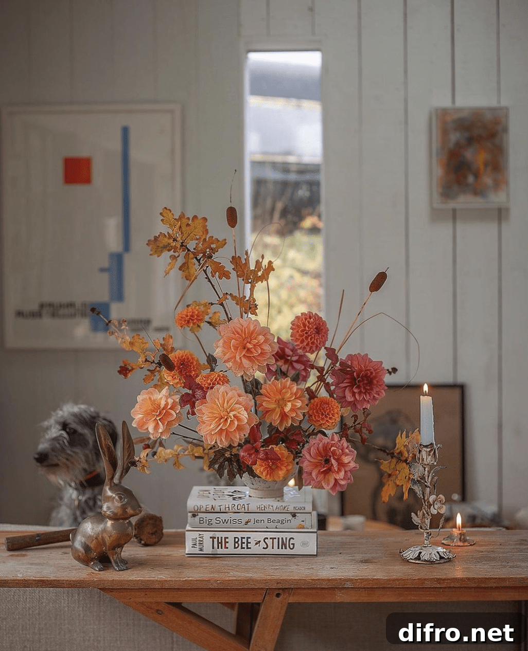 Fall arrangement on books.