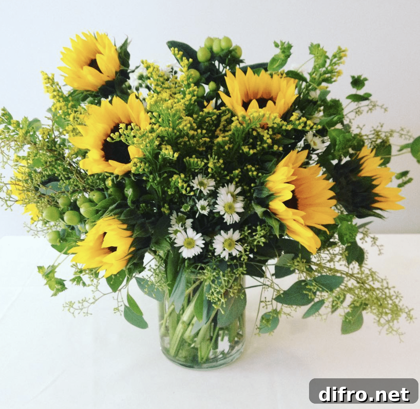 Sunflower arrangement in a glass vase.
