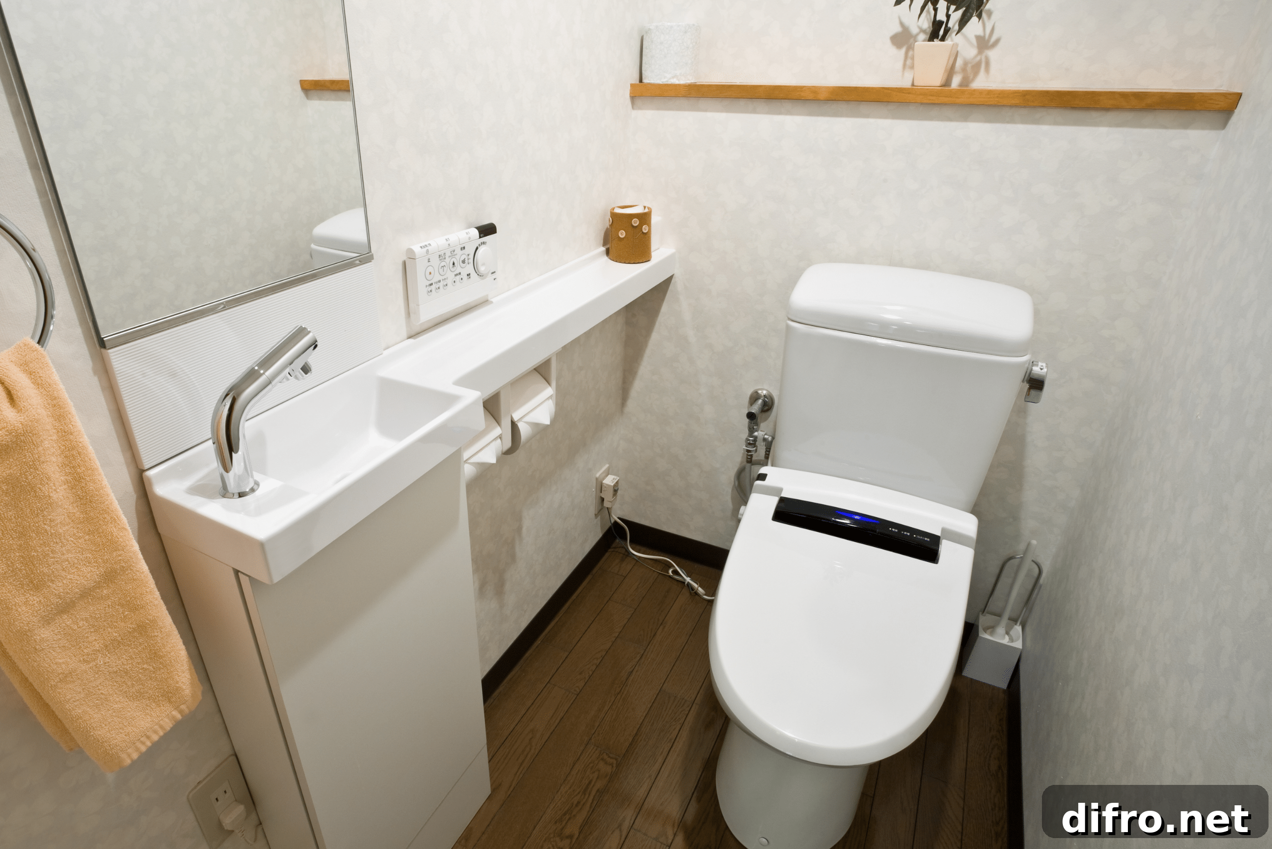 Small bathroom with tiny sink and toliet.