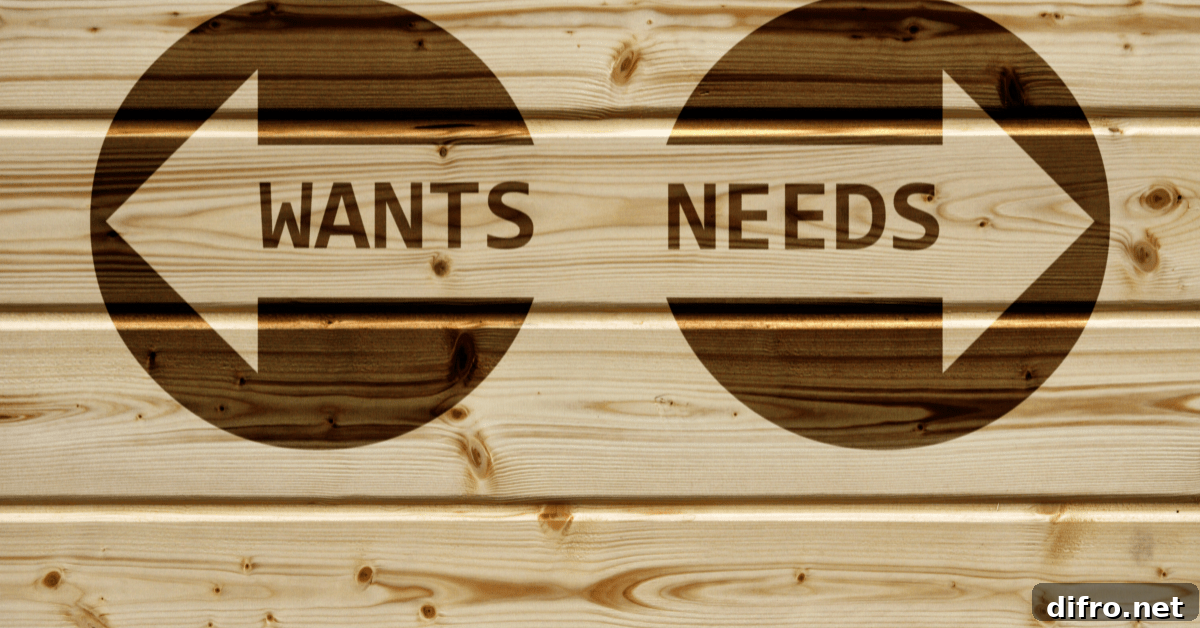 Wood with two arrows painted, one reading 'wants' and the other 'needs'