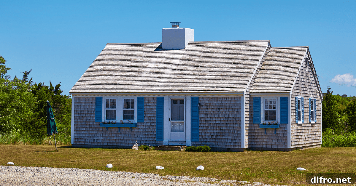 Small Cape Cod house with blue accents.