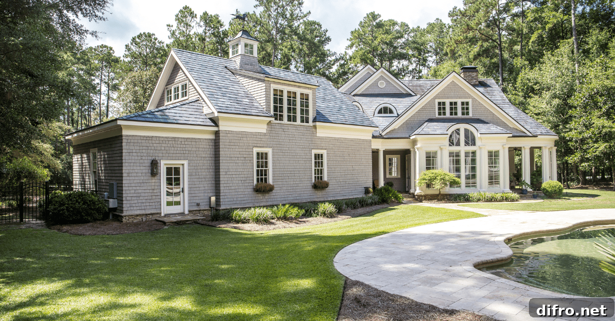 Large Cape Cod house with concrete walk way.