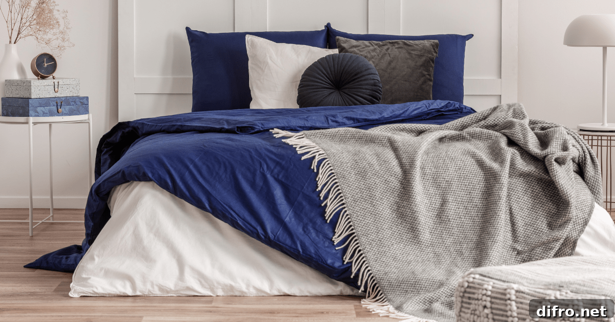 Bed with various color pillows and sheets.