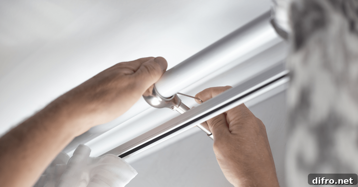 Person's hands securing curtains rods.