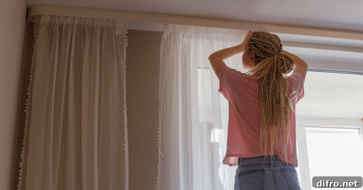 Person adjusting curtains.