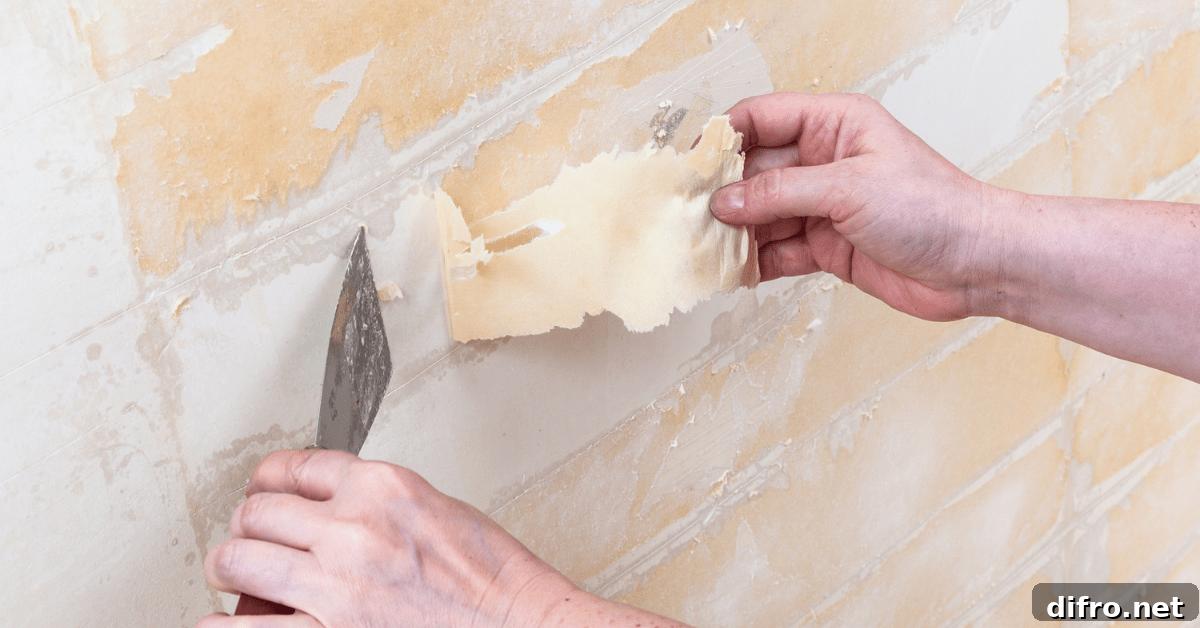 Hand peeling back wallpaper.