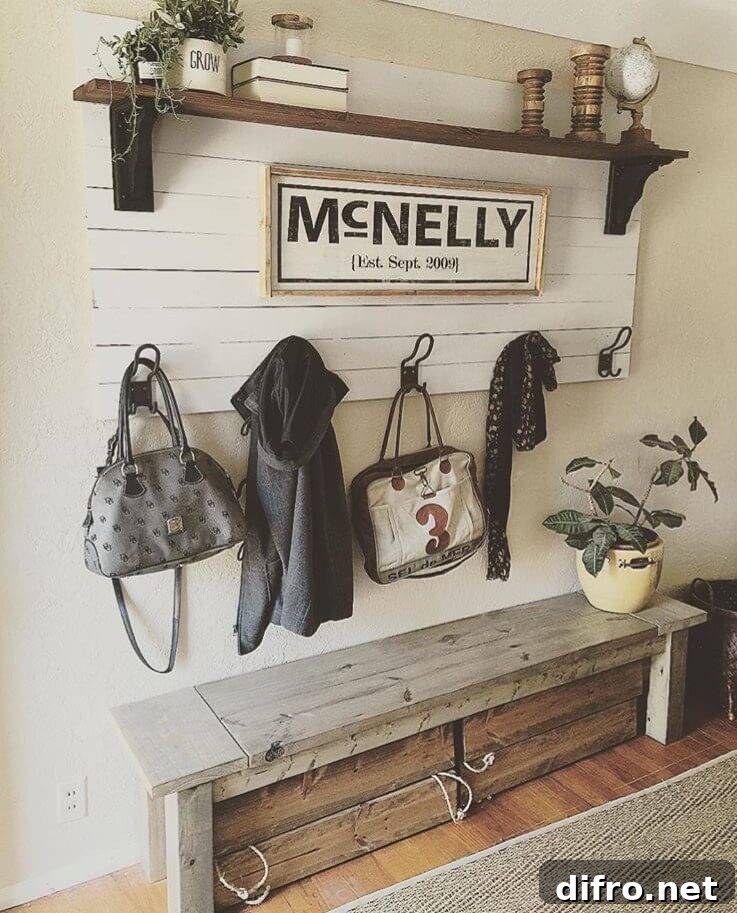 farmhouse country chic entry way pallet sign wood shelf old wood bench hanging jackets and greenery