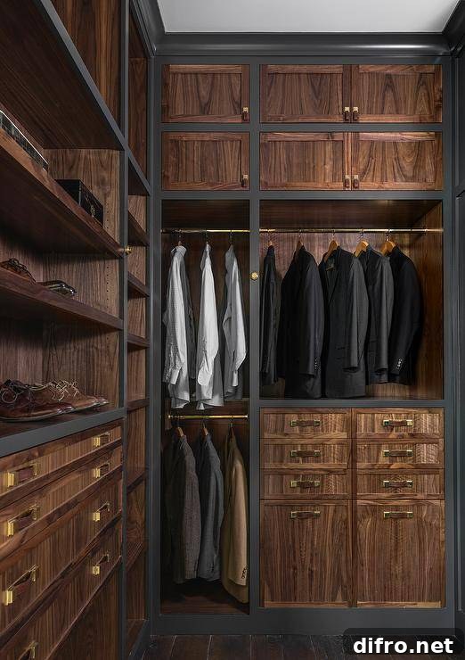 Men's closet with veneer cabinet doors, built-in shoe shelves, and brass hardware.