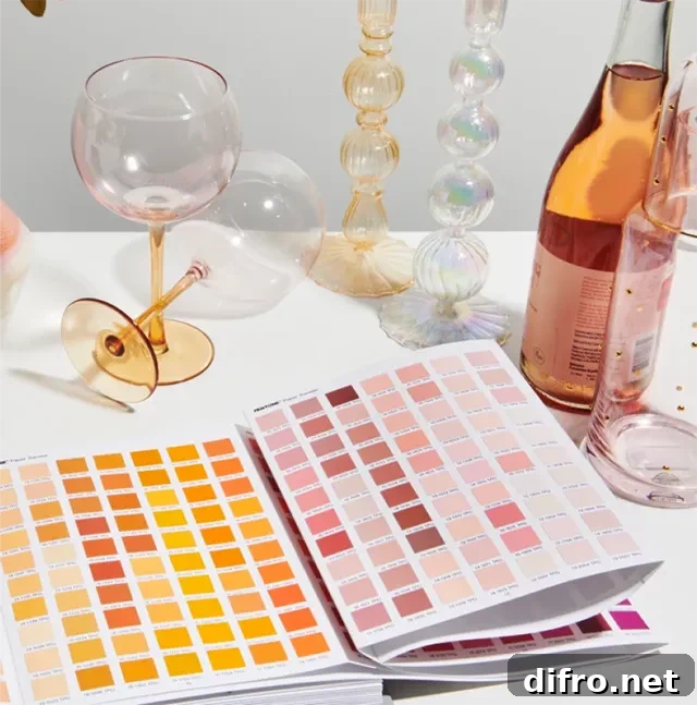 Wine and glasses on a table with an open Peach Fuzz 13-1023 color palette.