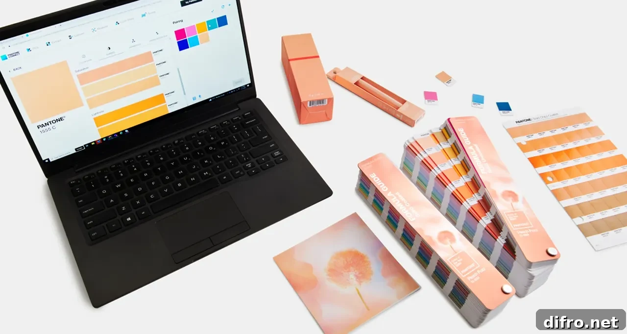 Laptop behind color palettes of Peach Fuzz 13-1023.