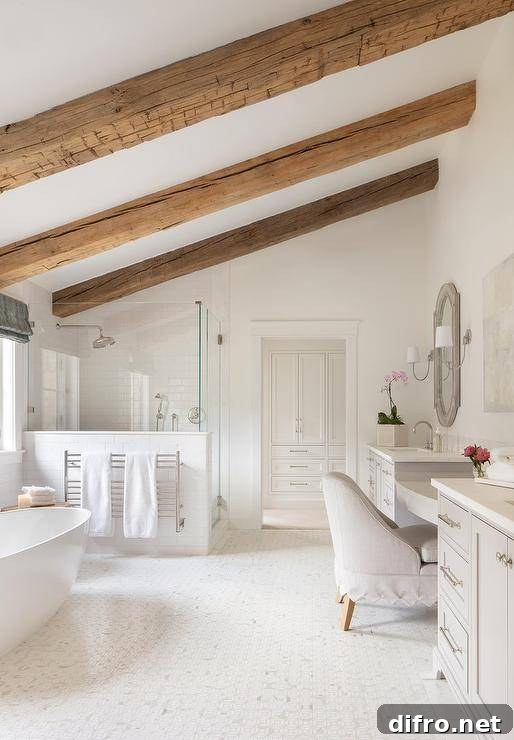 Ceiling Design Ideas to Add Personality to Your Home 5 Rustic wood beams accent a sloped bathroom ceiling and are fixed above an oval freestanding bathtub positioned under a window to the side of a towel warmer mounted against a shower.