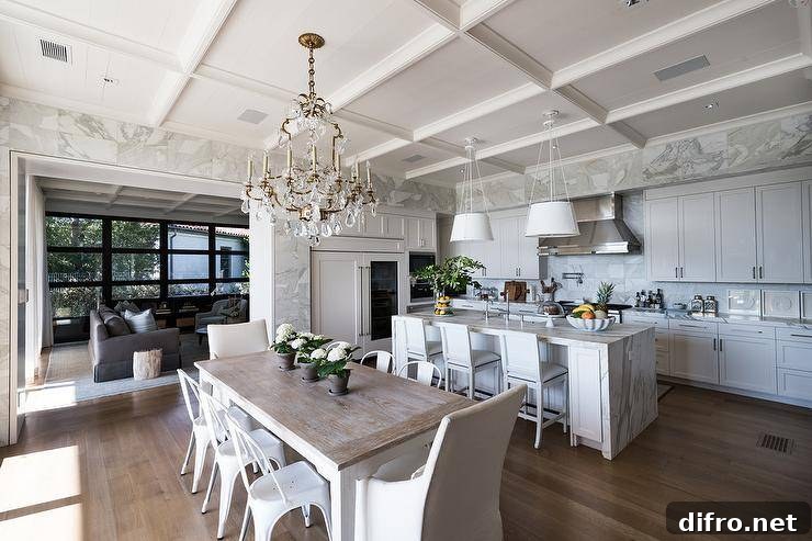 Ceiling Design Ideas to Add Personality to Your Home 9 Large, gorgeous open concept kitchen into a dining room featuring a white two-tone farmhouse dining table with white Tolix chairs and natural linen end chairs. A French crystal chandelier drapes over the modern farmhouse table from stunning coffered ceilings.
