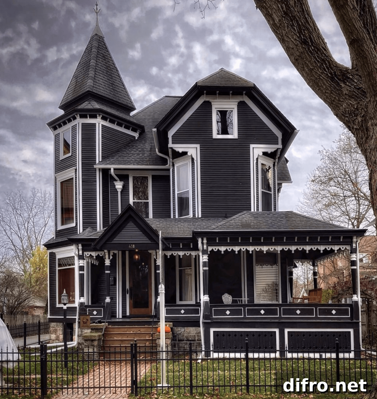 Victorian home exterior with ornate decorative trim and a turret.