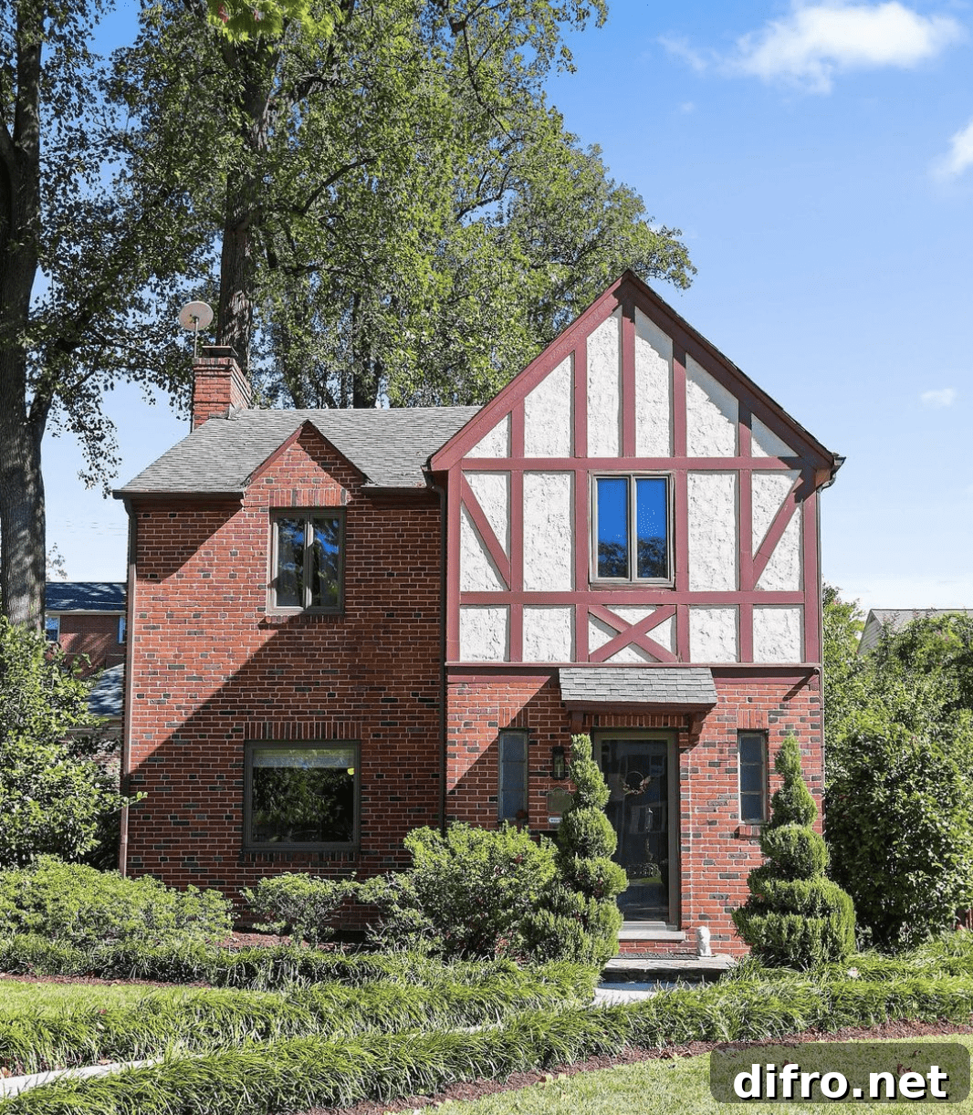 Tudor style home exterior with steep roof and half-timbering.
