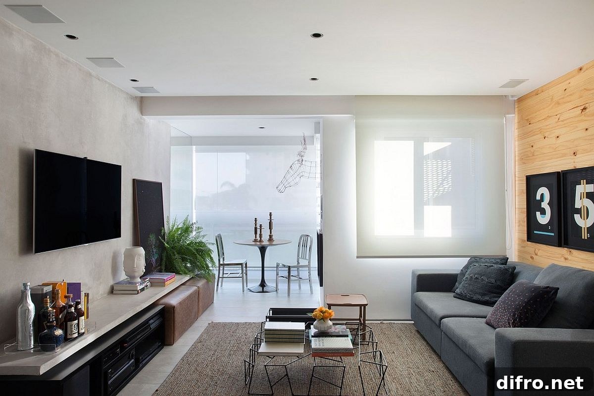 Studio apartment with sheers filtering in natural light.