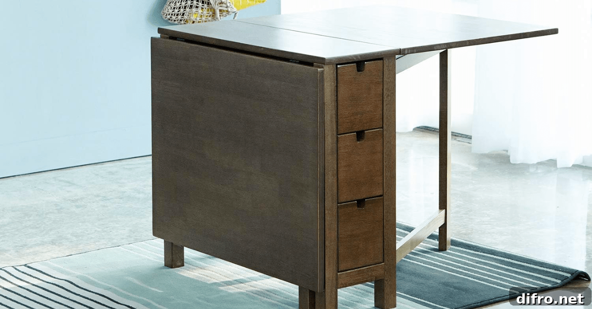 Wooden drop leaf table with one section folded down.
