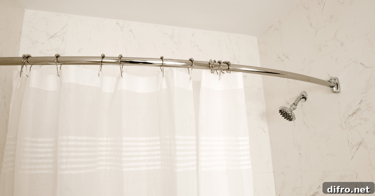 White standard shower curtain size hung on metal rod.