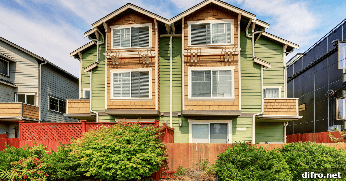 Green painted exterior of a duplex home.