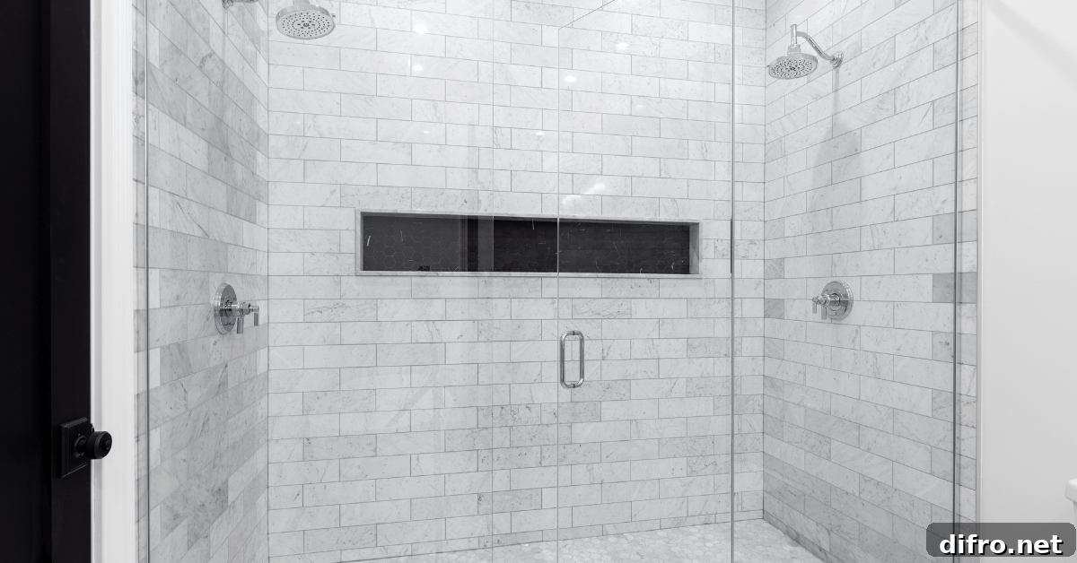 Marble subway tile shower with glass door.