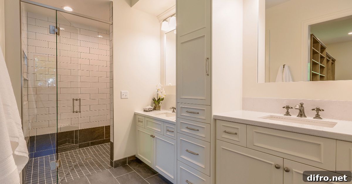 White subway tile shower with black floor tiles and glass door.