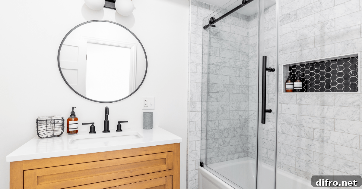 Glass shower with subway tile shower and black fixtures.