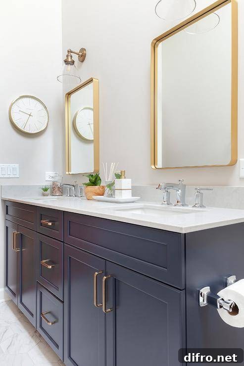 Washstand featuring mixed metals from chrome faucets to brass pulls.
